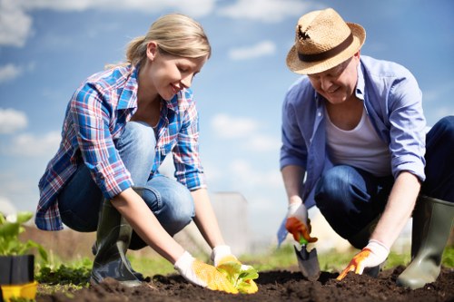 Garden maintenance in Woodside Park with a neatly trimmed lawn and borders